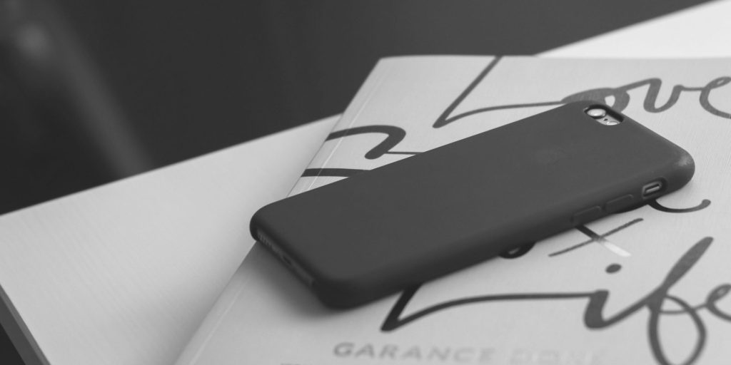 Phone face down on a journal Orapin // PurposeDriven PR