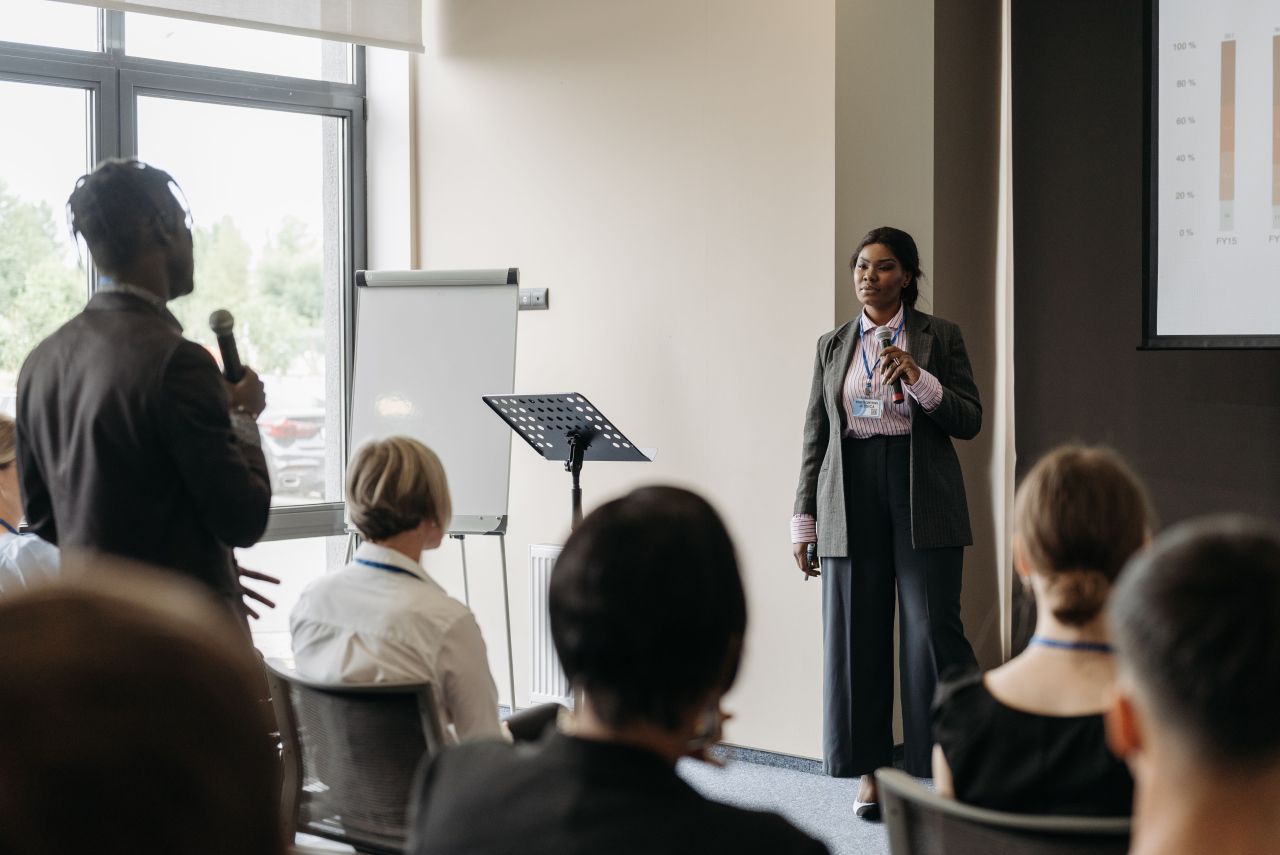 Nonprofit leader speaking on a conference panel, one channel of an expert positioning strategy. Photo by Pavel Danilyuk via Pexels.