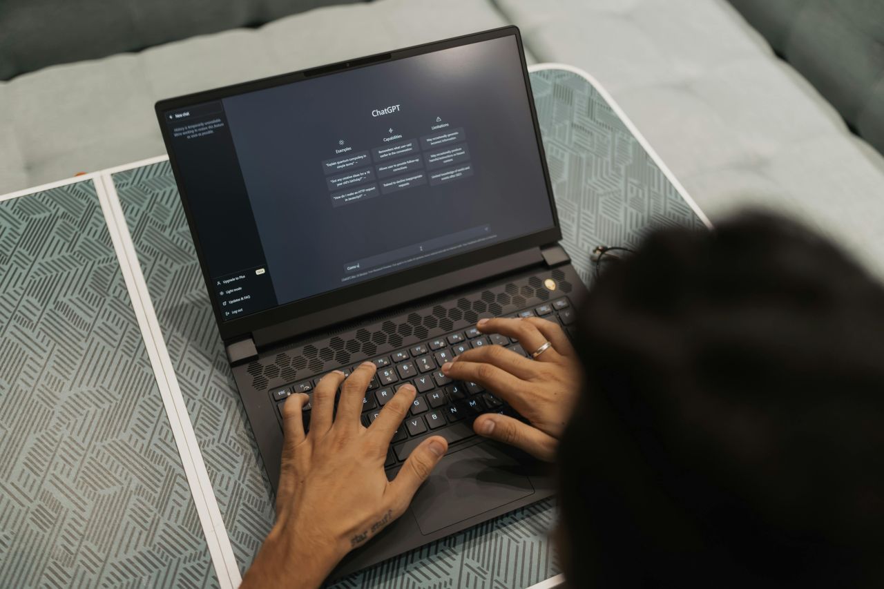 comms leader reviewing AI press release draft on laptop while using AI for PR work